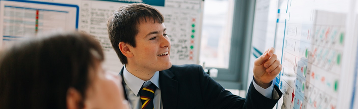 Student writing on a whiteboard